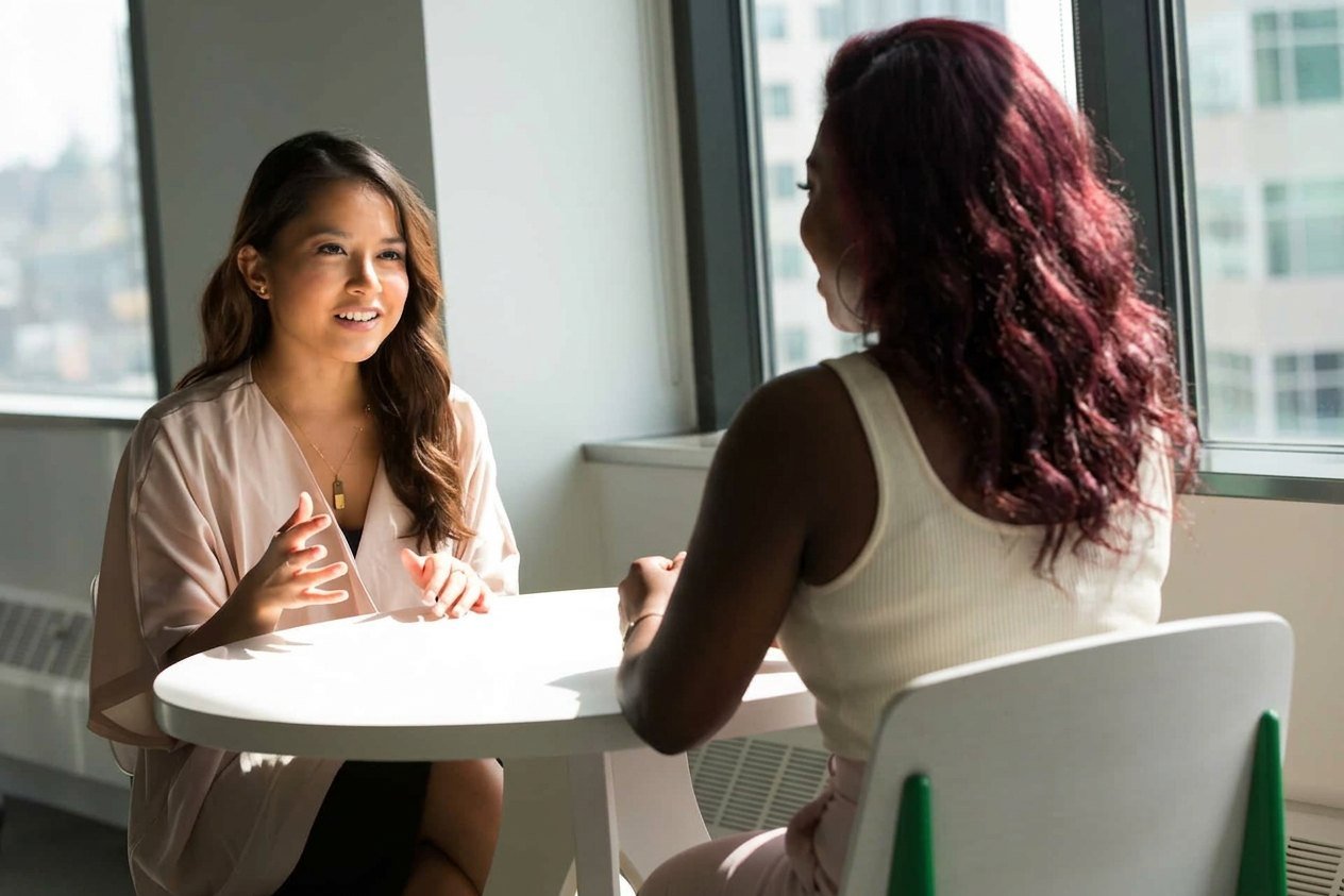 A student talking through her plans in a one-to-one coaching session
